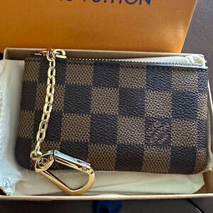 New in box brown checkerboard Damier ebene key chain pouch.